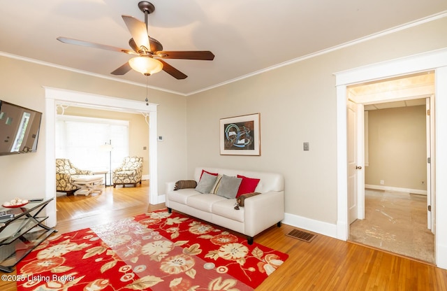 1860 Alfresco Pl, Louisville, KY 40205 - living room with a ceiling fan, wood finished floors, and ornamental molding