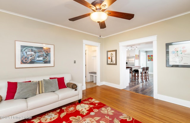 1860 Alfresco Pl, Louisville, KY 40205 - living area with wood finished floors, crown molding, a ceiling fan, and a chandelier