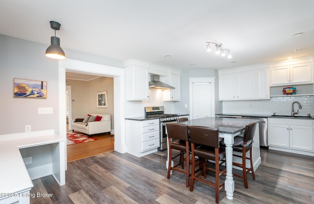 1860 Alfresco Pl, Louisville, KY 40205 - kitchen with appliances with stainless steel finishes, wall chimney exhaust hood, backsplash, and white cabinets