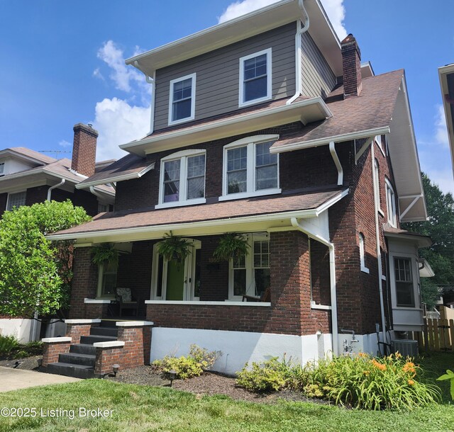 1860 Alfresco Pl, Louisville, KY 40205 - traditional style home featuring a porch, a chimney, and brick siding