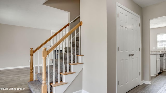 4806 Middlesex Dr, Louisville, KY 40245 - staircase featuring wood finished floors and baseboards