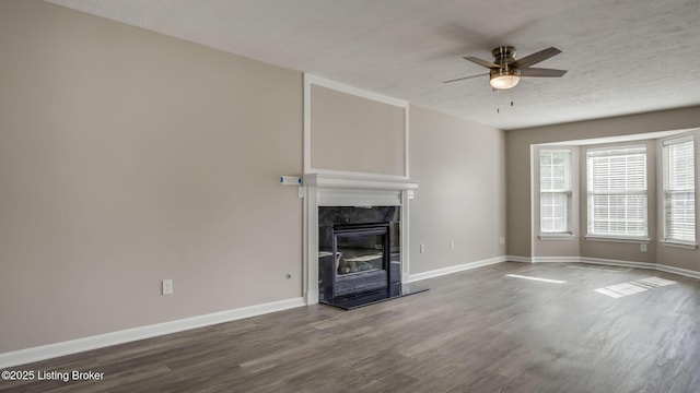 4806 Middlesex Dr, Louisville, KY 40245 - unfurnished living room with ceiling fan, wood finished floors, a high end fireplace, and a textured ceiling