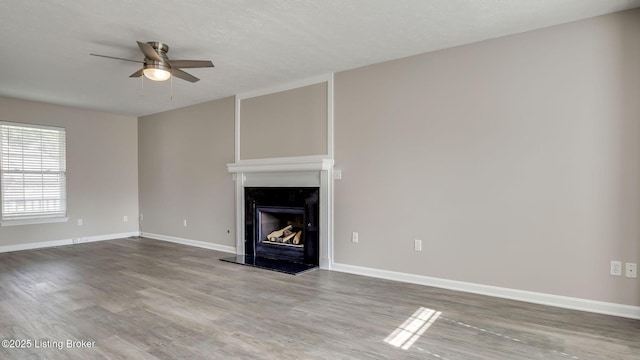 4806 Middlesex Dr, Louisville, KY 40245 - unfurnished living room with ceiling fan, wood finished floors, and a fireplace with raised hearth