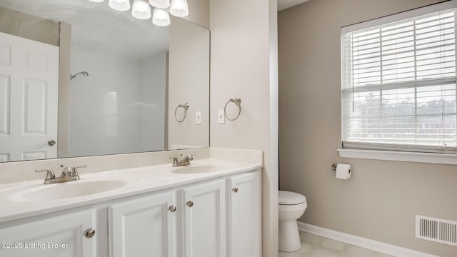 4806 Middlesex Dr, Louisville, KY 40245 - full bathroom with toilet and double vanity