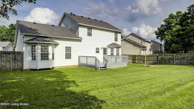 4806 Middlesex Dr, Louisville, KY 40245 - back of property with a deck, a fenced backyard, and a shingled roof