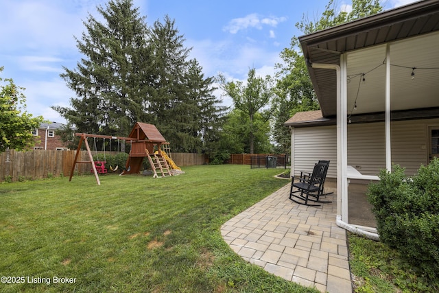 614 Armadale Pl, Douglass Hills, KY 40243 - fenced backyard featuring a playground and a patio