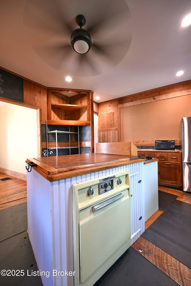 1819 Eastern Pkwy, Louisville, KY 40204 - kitchen with freestanding refrigerator, recessed lighting, a ceiling fan, and wood counters