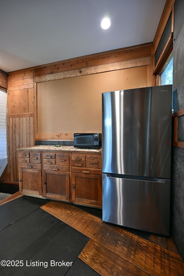 1819 Eastern Pkwy, Louisville, KY 40204 - kitchen featuring freestanding refrigerator, black microwave, and light countertops