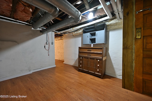 1819 Eastern Pkwy, Louisville, KY 40204 - unfinished basement with wood finished floors and baseboards