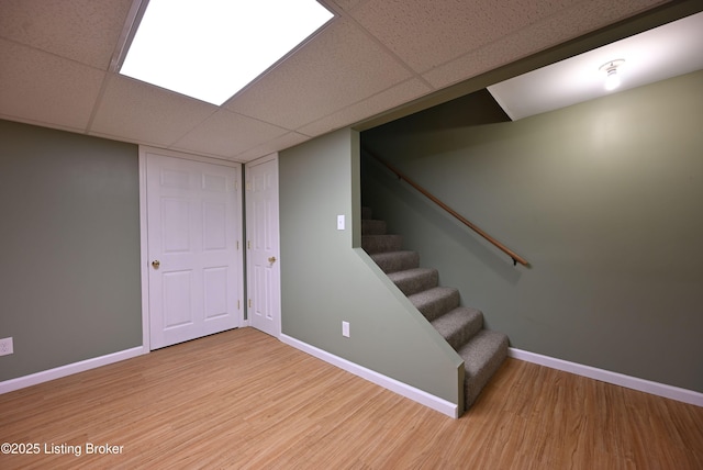 8705 Clover Ct, Louisville, KY 40242 - finished basement featuring wood finished floors, stairway, and a paneled ceiling