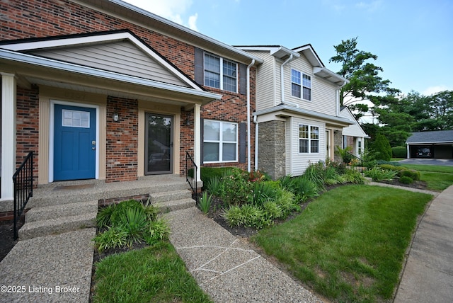 8705 Clover Ct, Louisville, KY 40242 - view of front of property with brick siding and a front yard