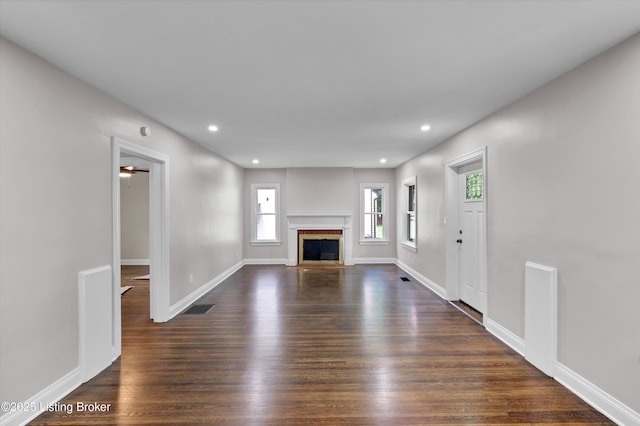2620 Algonquin Pkwy, Louisville, KY 40210 - unfurnished living room with recessed lighting, dark wood-style floors, and a fireplace with flush hearth