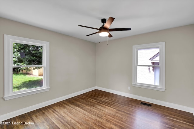 2620 Algonquin Pkwy, Louisville, KY 40210 - spare room with dark wood-style flooring and ceiling fan