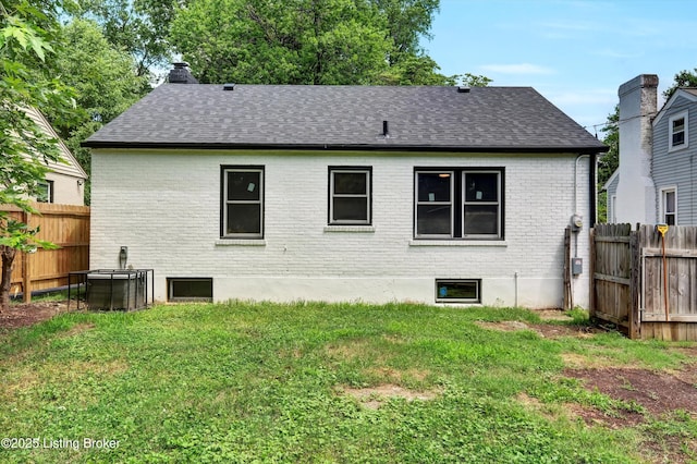 2620 Algonquin Pkwy, Louisville, KY 40210 - rear view of property with a shingled roof, brick siding, and a chimney