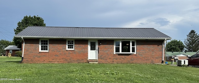 106 Sunflower Dr, Campbellsville, KY 42718 - view of front facade featuring a front yard, a metal roof, and brick siding