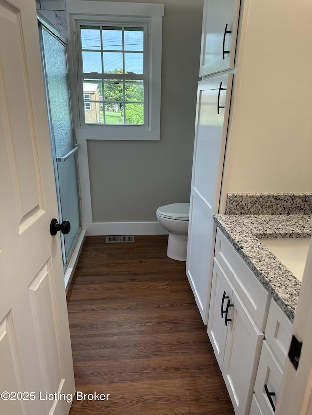 106 Sunflower Dr, Campbellsville, KY 42718 - bathroom with vanity, a stall shower, and wood finished floors