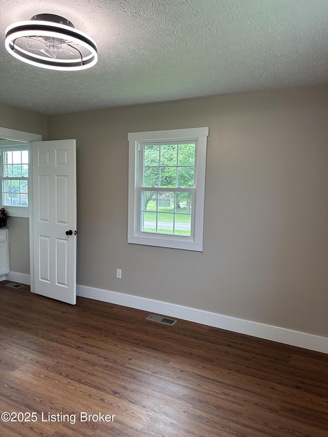 106 Sunflower Dr, Campbellsville, KY 42718 - unfurnished room with dark wood-style floors and a textured ceiling