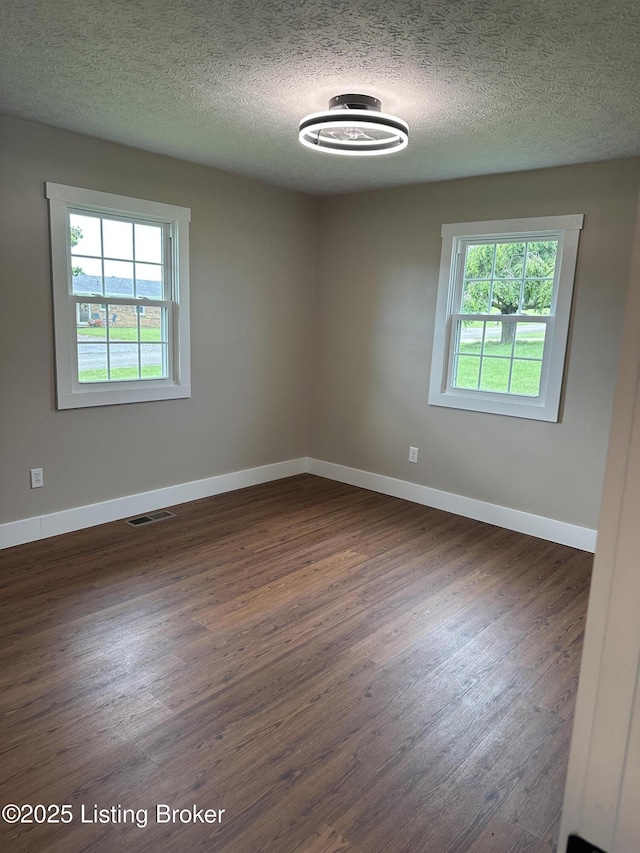 106 Sunflower Dr, Campbellsville, KY 42718 - empty room with dark wood-style floors and a textured ceiling
