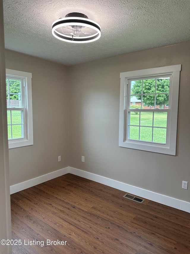 106 Sunflower Dr, Campbellsville, KY 42718 - empty room featuring wood finished floors and a textured ceiling