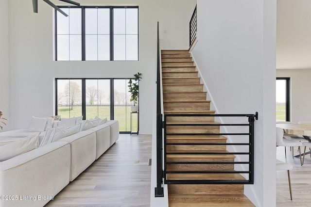 1160 Equestrian Lakes Ln, Finchville, KY 40022 - stairs with wood finished floors and a towering ceiling