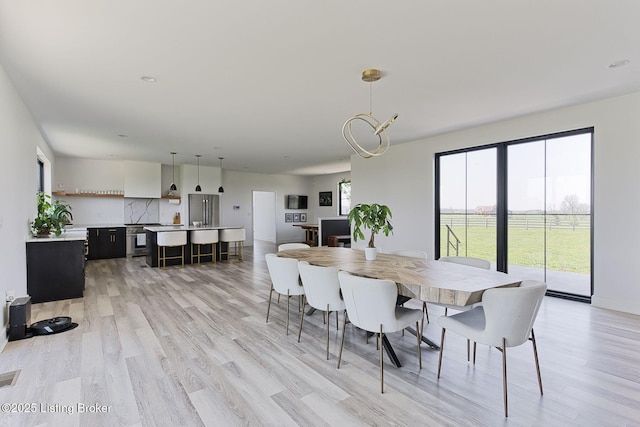 1160 Equestrian Lakes Ln, Finchville, KY 40022 - dining space featuring light wood-type flooring and baseboards