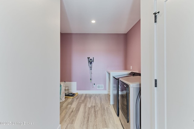 1160 Equestrian Lakes Ln, Finchville, KY 40022 - laundry room with washing machine and clothes dryer, light wood-type flooring, and recessed lighting