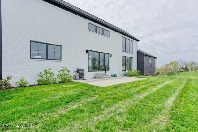 1160 Equestrian Lakes Ln, Finchville, KY 40022 - back of property featuring a patio, a lawn, and brick siding