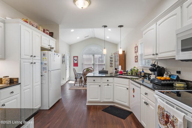 3105 Arbor Ridge Ln, New Albany, IN 47150 - kitchen featuring white appliances, a peninsula, dark wood-type flooring, vaulted ceiling, and white cabinets