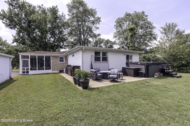 10703 Cedar Creek Rd, Louisville, KY 40229 - back of house featuring a hot tub, a patio, a lawn, and a sunroom