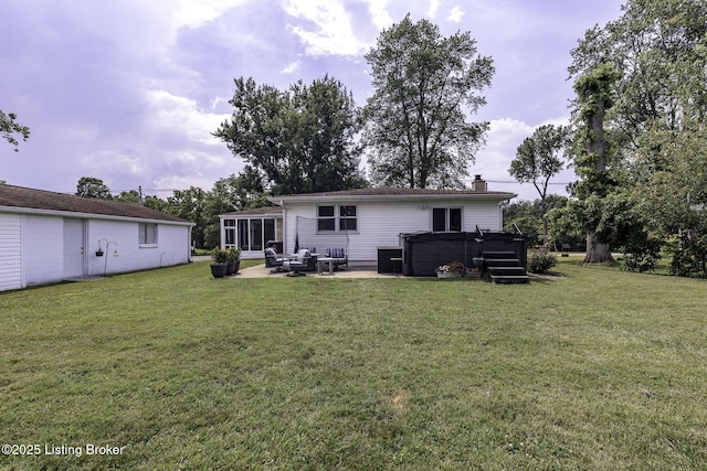 10703 Cedar Creek Rd, Louisville, KY 40229 - rear view of property with a hot tub, a patio area, a yard, a chimney, and an outdoor hangout area