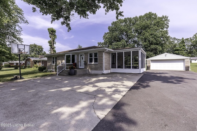 10703 Cedar Creek Rd, Louisville, KY 40229 - ranch-style home featuring stone siding, a garage, an outdoor structure, and a sunroom
