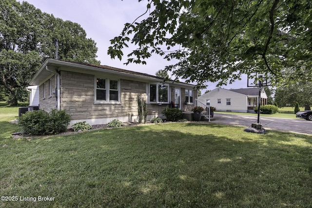 10703 Cedar Creek Rd, Louisville, KY 40229 - view of front of house featuring stone siding and a front yard