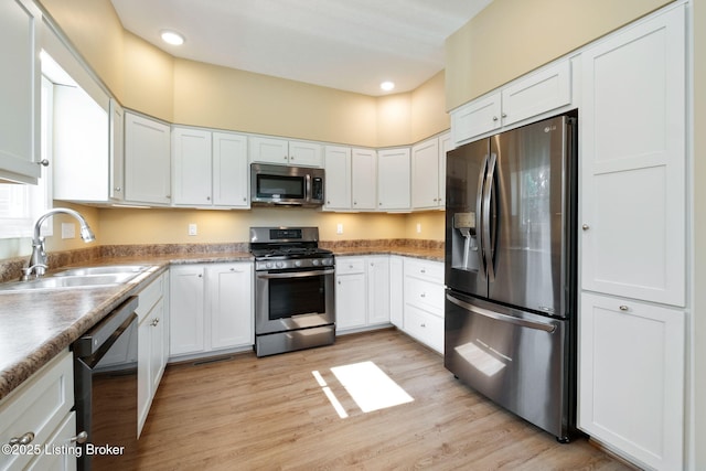 4200 Fort Ave, Vine Grove, KY 40175 - kitchen with stainless steel appliances, white cabinetry, light wood-style flooring, and recessed lighting