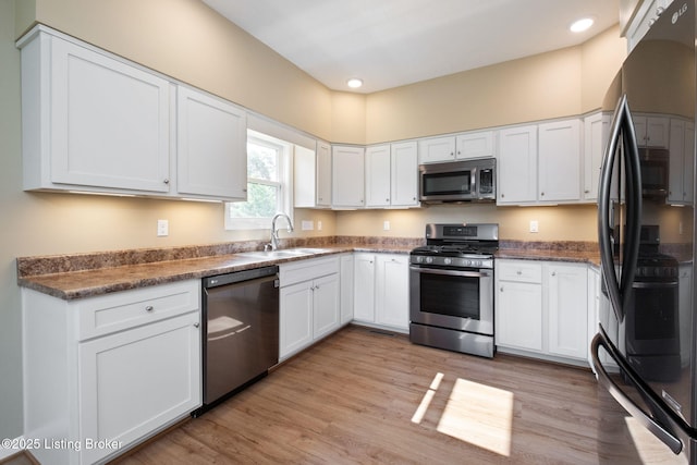 4200 Fort Ave, Vine Grove, KY 40175 - kitchen featuring stainless steel appliances, white cabinetry, light wood-style flooring, and recessed lighting