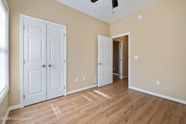 4200 Fort Ave, Vine Grove, KY 40175 - unfurnished bedroom with light wood-type flooring, a closet, and ceiling fan