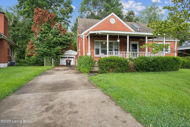 4418 Mann Ave, Louisville, KY 40215 - bungalow-style house featuring a front lawn, brick siding, an outbuilding, covered porch, and a shingled roof