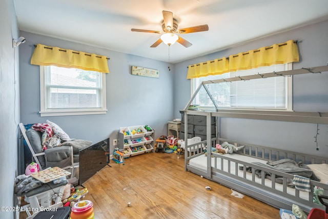 4418 Mann Ave, Louisville, KY 40215 - bedroom with multiple windows, wood finished floors, and ceiling fan