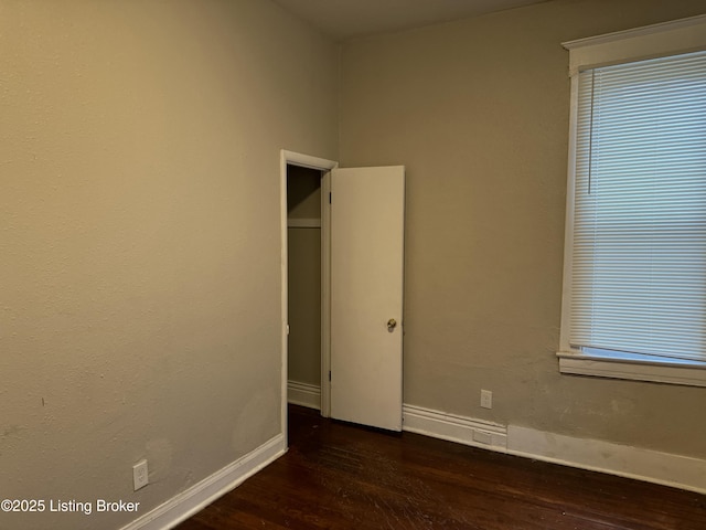 1851 Date St, Louisville, KY 40210 - unfurnished room with dark wood finished floors and baseboards