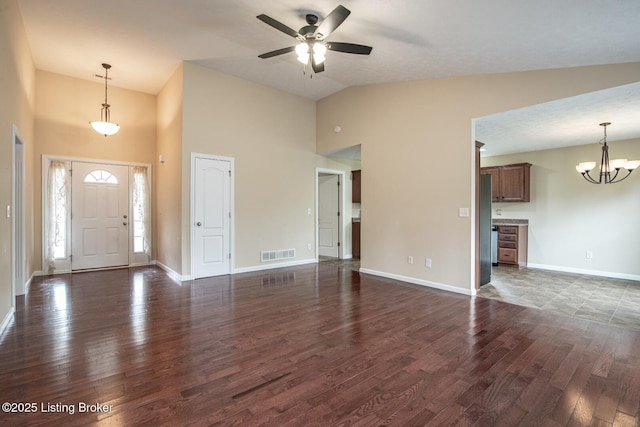 128 Boone Trce, Radcliff, KY 40160 - foyer entrance featuring high vaulted ceiling, dark wood-style flooring, a ceiling fan, and a chandelier