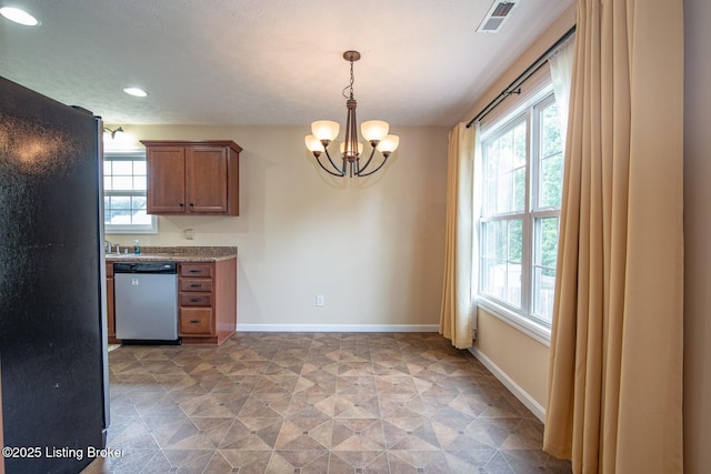 128 Boone Trce, Radcliff, KY 40160 - kitchen with stainless steel dishwasher, plenty of natural light, a chandelier, and recessed lighting