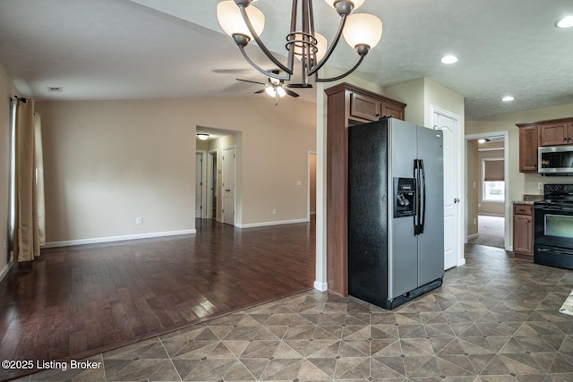 128 Boone Trce, Radcliff, KY 40160 - kitchen featuring refrigerator with ice dispenser, stainless steel microwave, black range with electric cooktop, a chandelier, and open floor plan