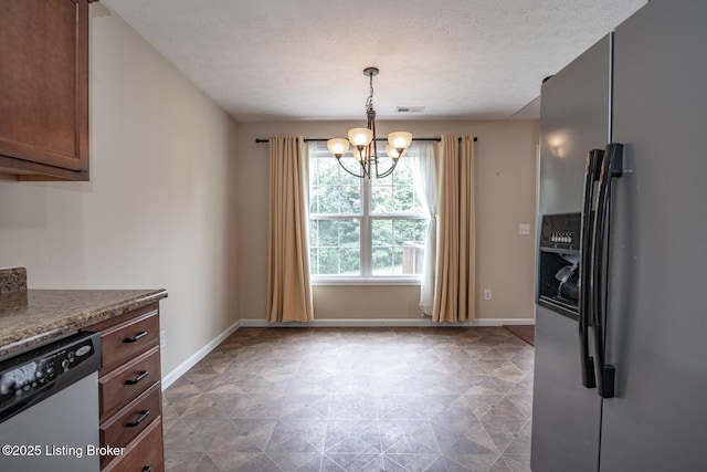 128 Boone Trce, Radcliff, KY 40160 - kitchen with stainless steel appliances, a chandelier, tile patterned floors, pendant lighting, and a textured ceiling