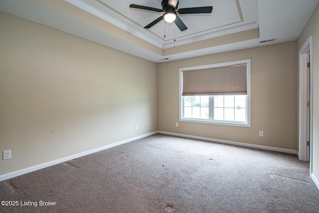 128 Boone Trce, Radcliff, KY 40160 - spare room with a tray ceiling, carpet flooring, crown molding, and a ceiling fan