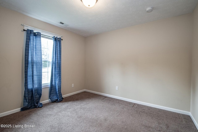 128 Boone Trce, Radcliff, KY 40160 - spare room featuring a smoke detector, carpet flooring, and a textured ceiling