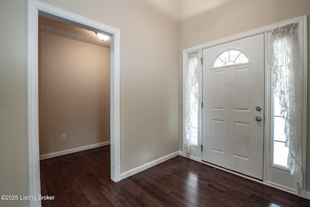 128 Boone Trce, Radcliff, KY 40160 - entryway featuring dark wood finished floors and baseboards