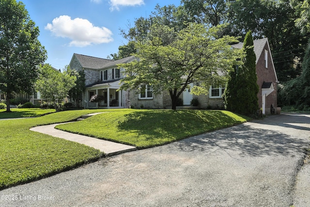 1724 Trevilian Way, Louisville, KY 40205 - view of front of property featuring a front lawn, stone siding, and driveway