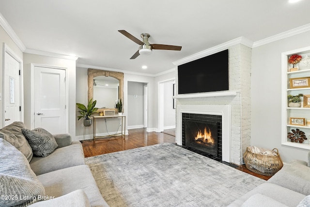 1724 Trevilian Way, Louisville, KY 40205 - living area featuring ceiling fan, wood finished floors, a fireplace, crown molding, and recessed lighting
