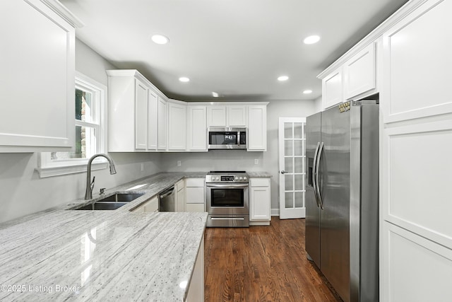 1724 Trevilian Way, Louisville, KY 40205 - kitchen featuring stainless steel appliances, recessed lighting, white cabinets, dark wood-style floors, and light stone counters
