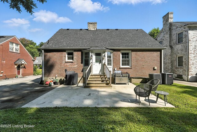 1724 Trevilian Way, Louisville, KY 40205 - back of property with entry steps, brick siding, roof with shingles, and a patio area