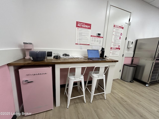 6355 Meeting St Unit 101, 201, Prospect, KY 40059 - kitchen with light wood-type flooring, refrigerator, an office area, and a kitchen breakfast bar